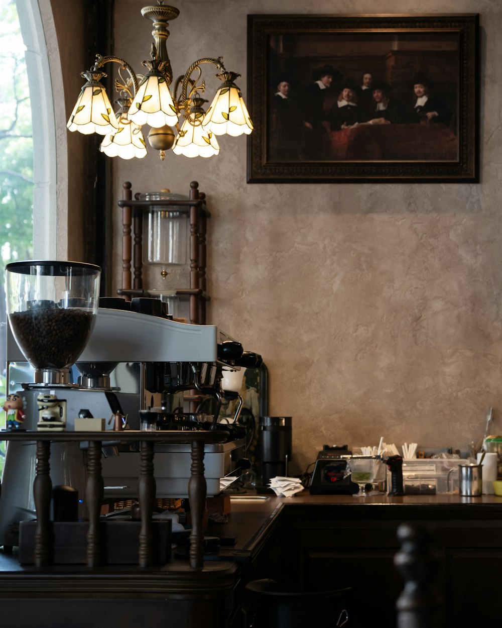 a coffee machine sitting on top of a counter next to a window