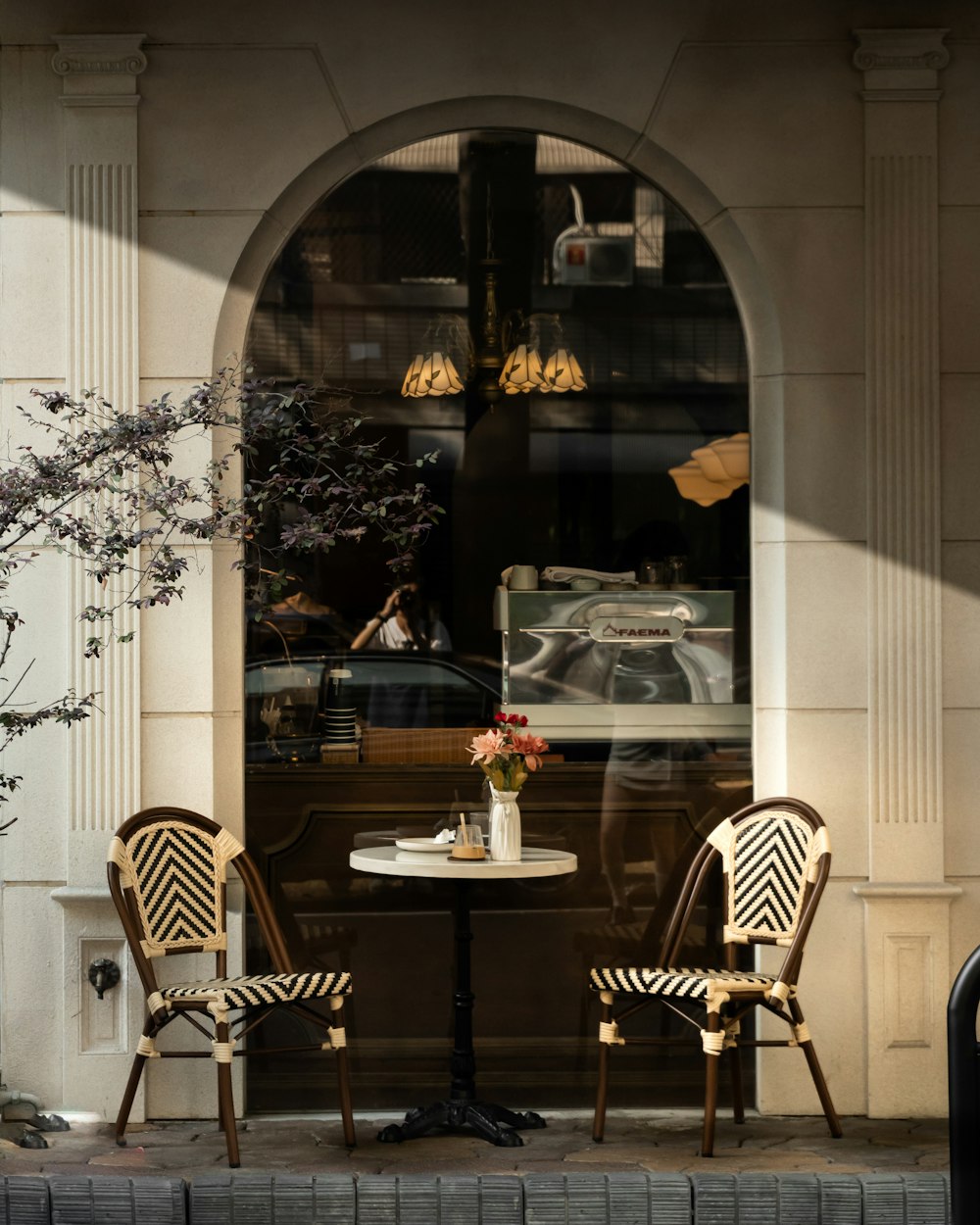 two chairs and a table in front of a window