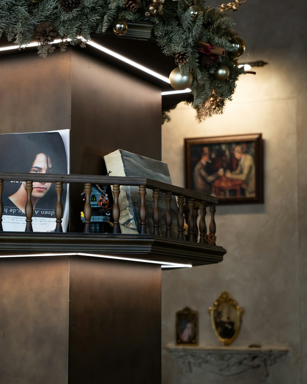 a picture of a woman's face on a shelf above a fireplace