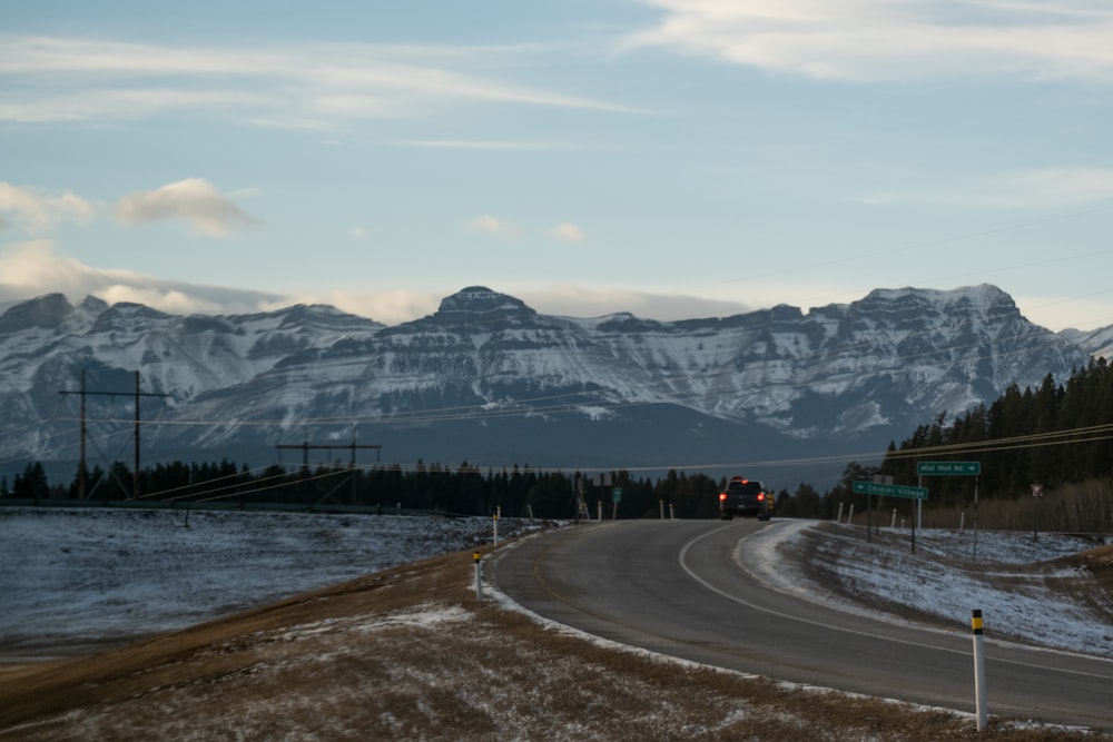 a road with a mountain in the background