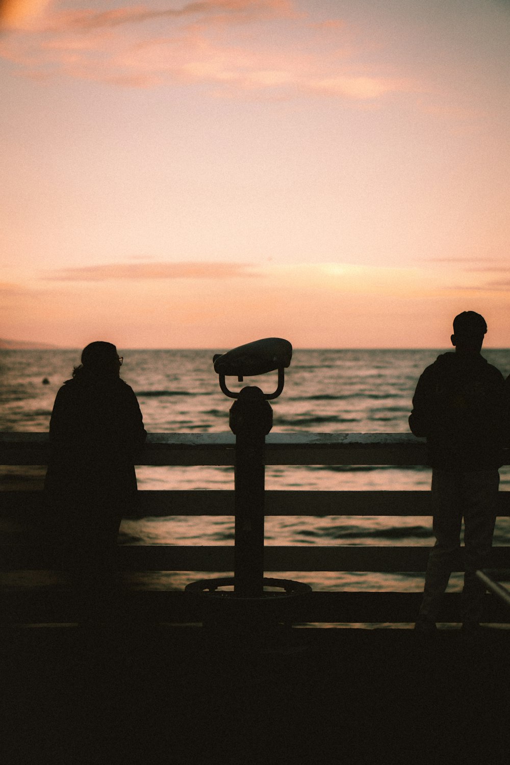 a couple of people standing next to a fire hydrant