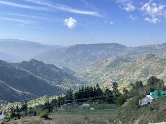 a view of a mountain range with houses on it