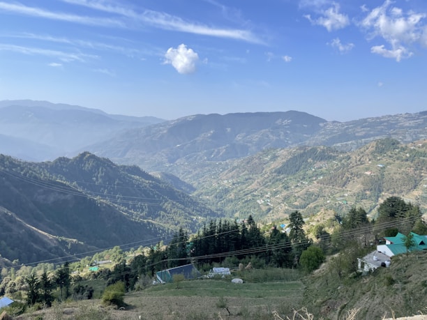 a view of a mountain range with houses on it
