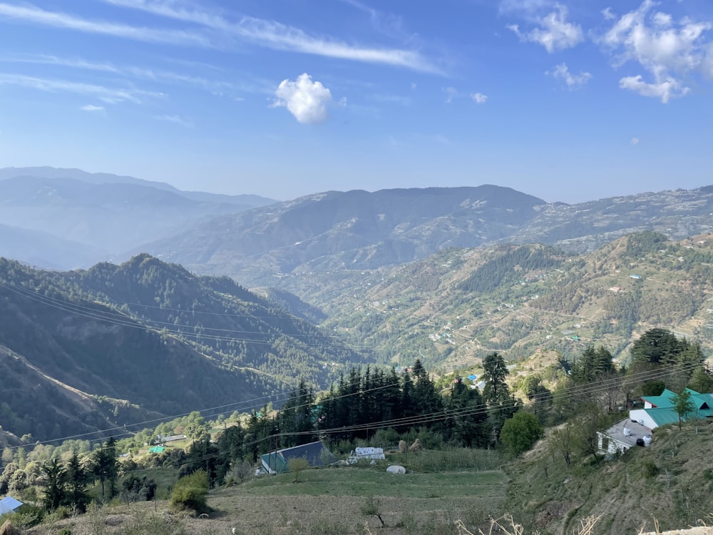 a view of a mountain range with houses on it