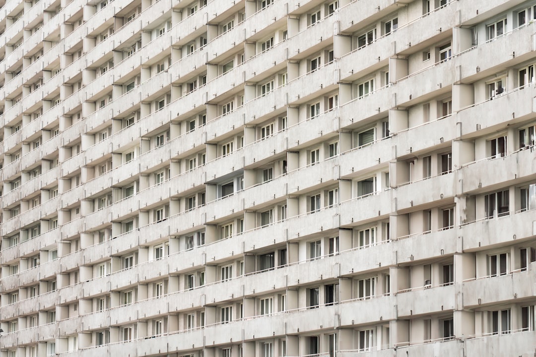 Tall concrete apartment block.