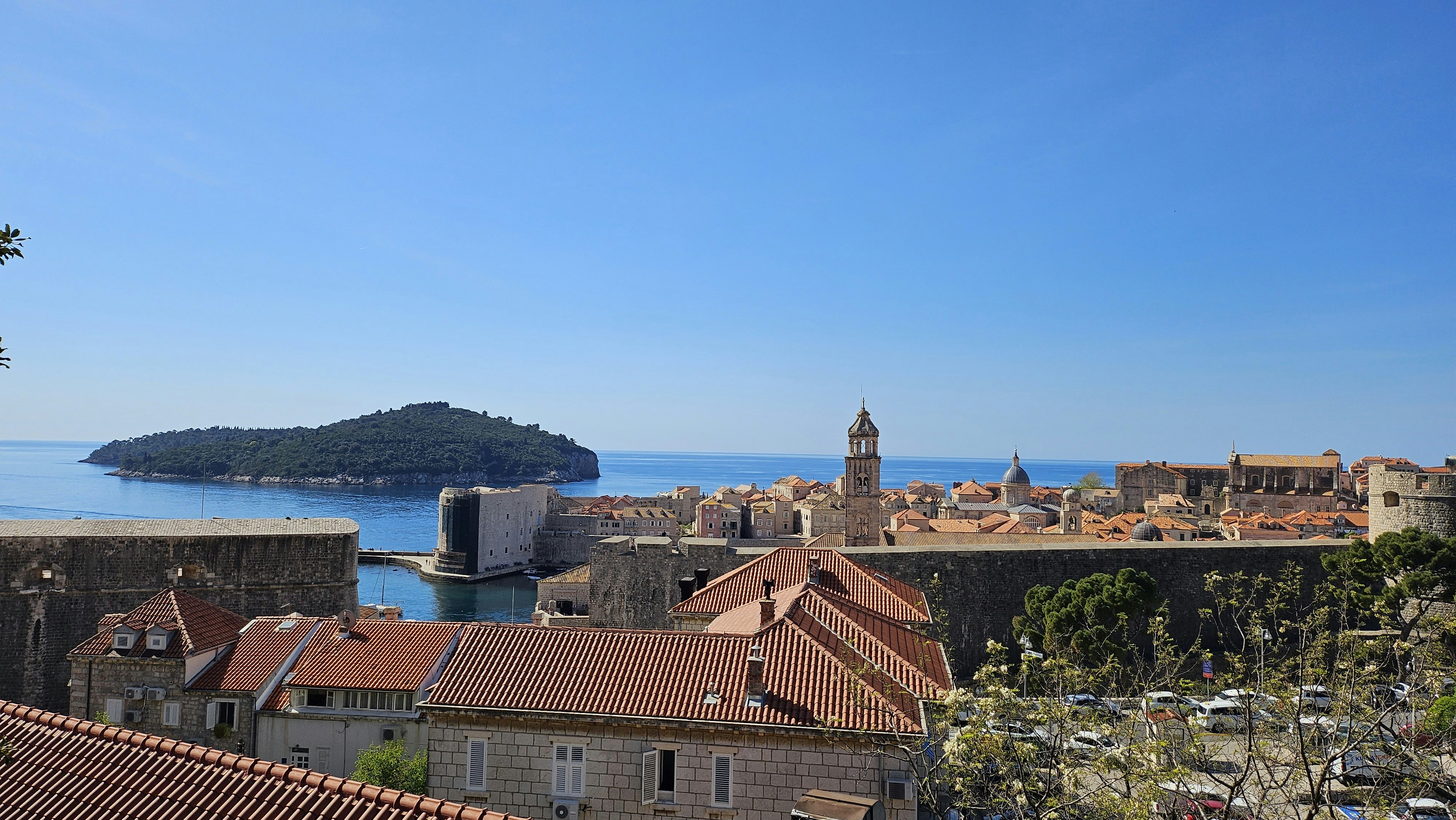 A view of a city with a bay in the background