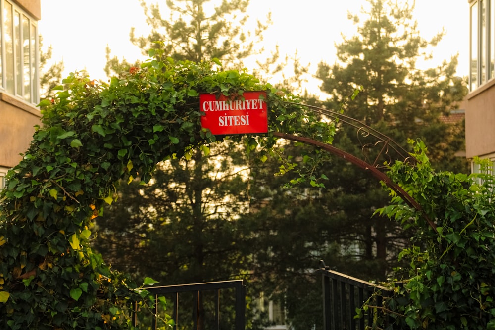 a red street sign hanging from the side of a metal pole