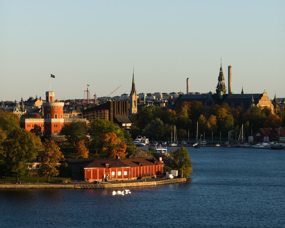 a body of water with a city in the background