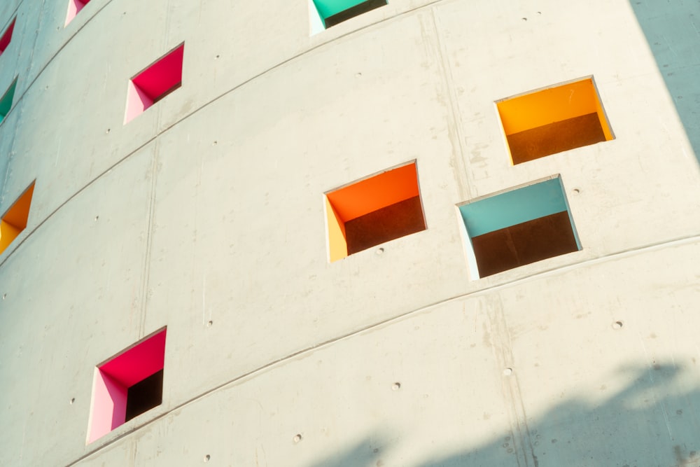 a multicolored building with several square windows