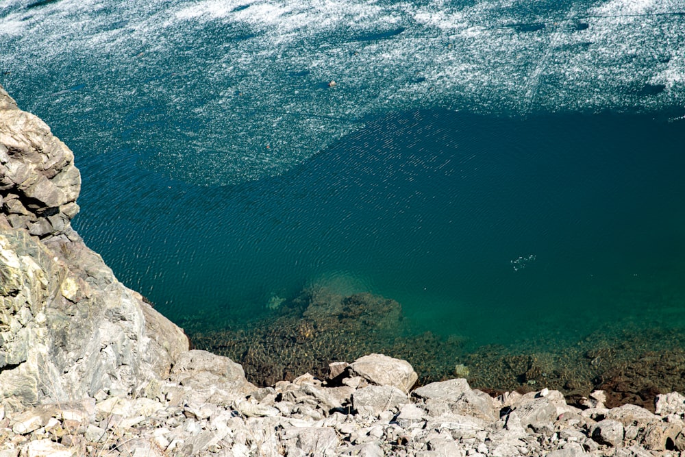 a large body of water surrounded by rocks