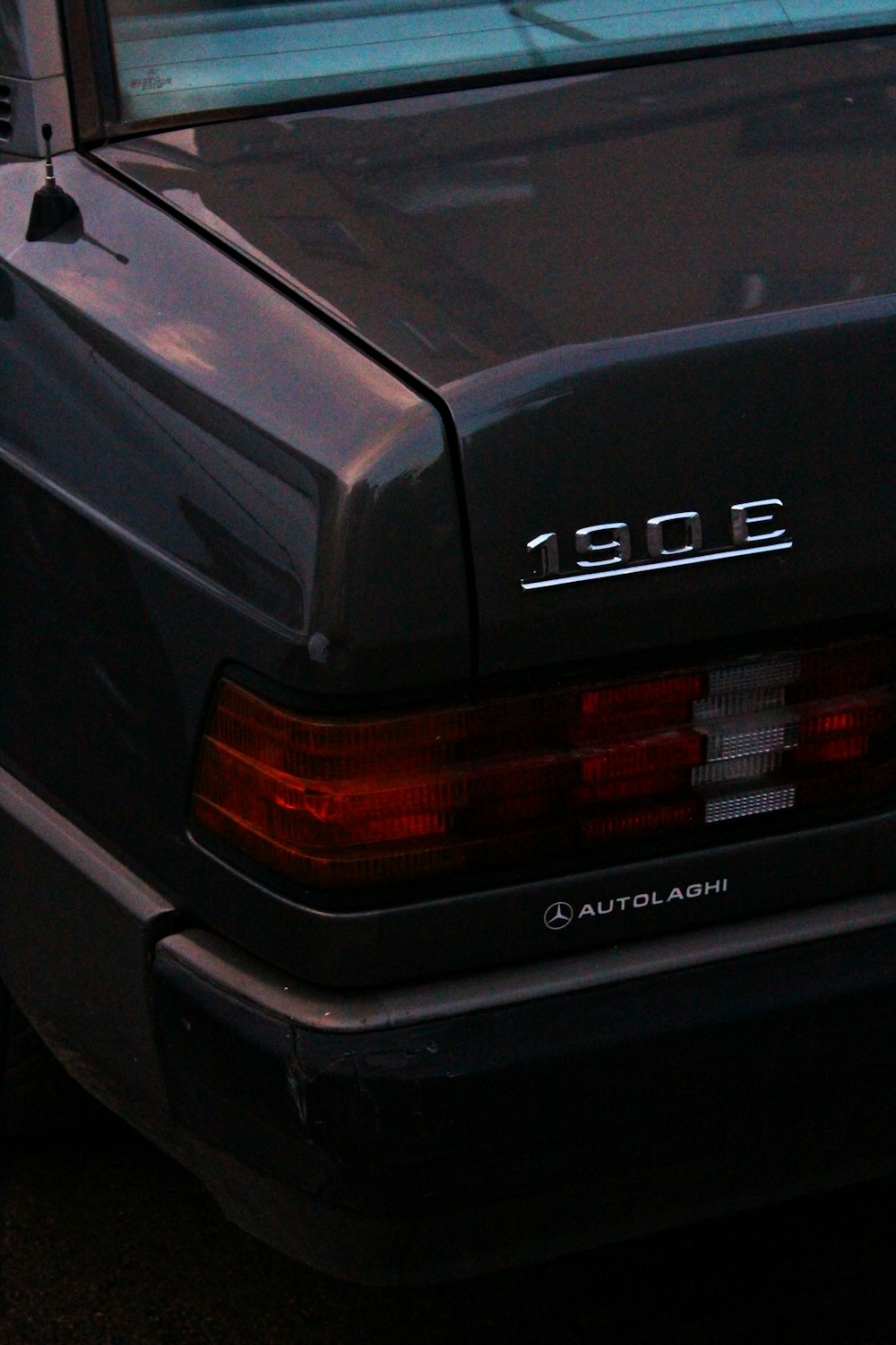 a black car parked in a parking lot