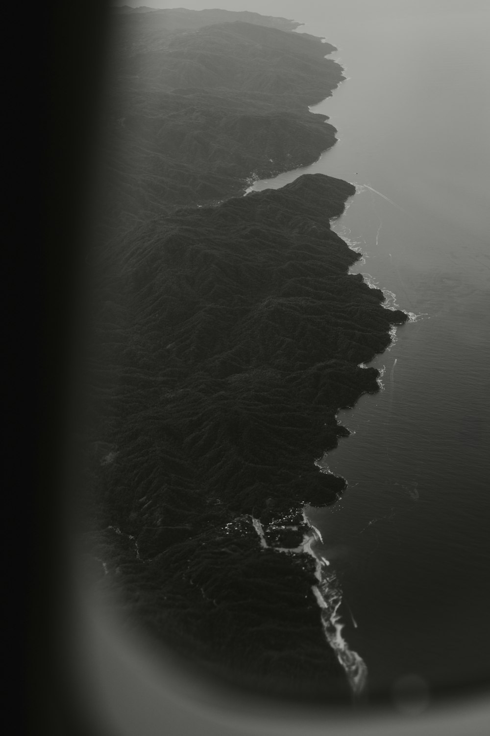 a view of the ocean from an airplane window