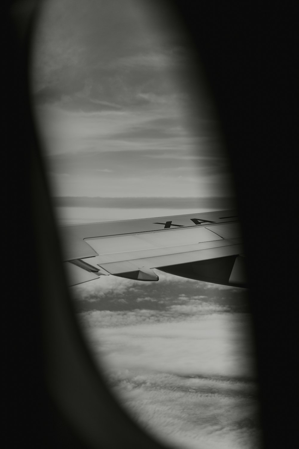 a view of the wing of an airplane in the sky