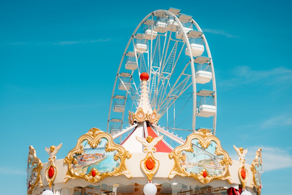 a carnival ride with a ferris wheel in the background