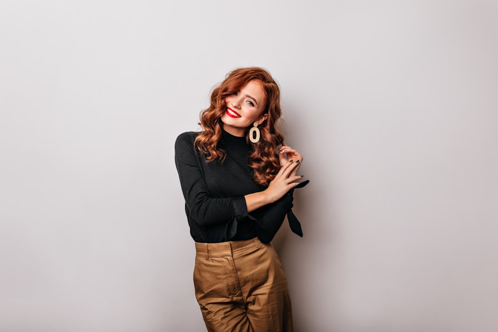 a woman posing for a picture with her hands on her hips