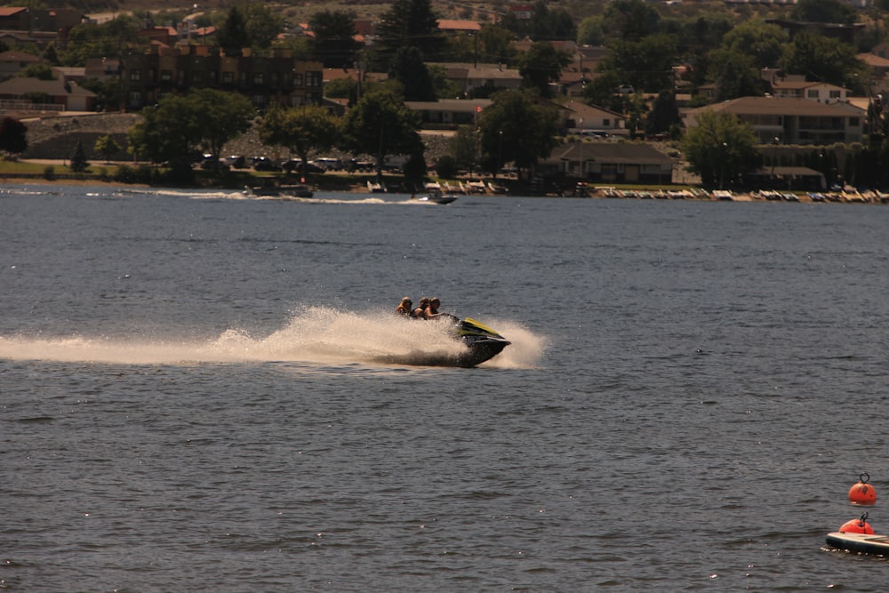 a person on a jet ski being pulled by a boat