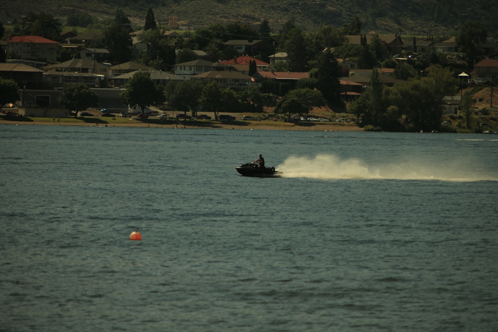 a person on a boat in the water