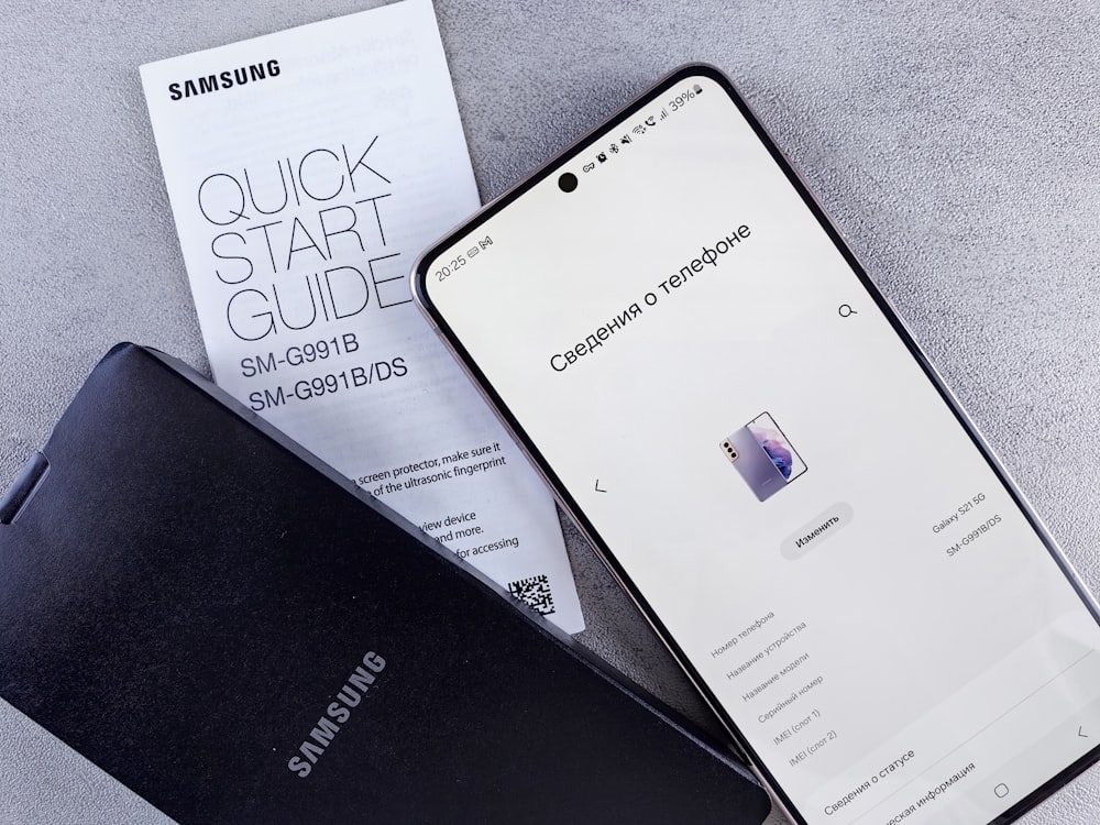 a samsung phone next to a samsung credit card