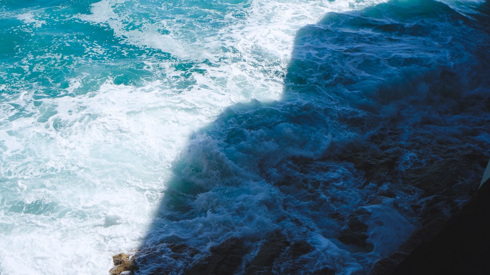 a person riding a surf board on a wave