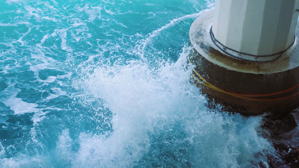 a pipe sticking out of the ocean water