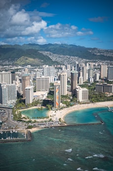 an aerial view of a city and the ocean