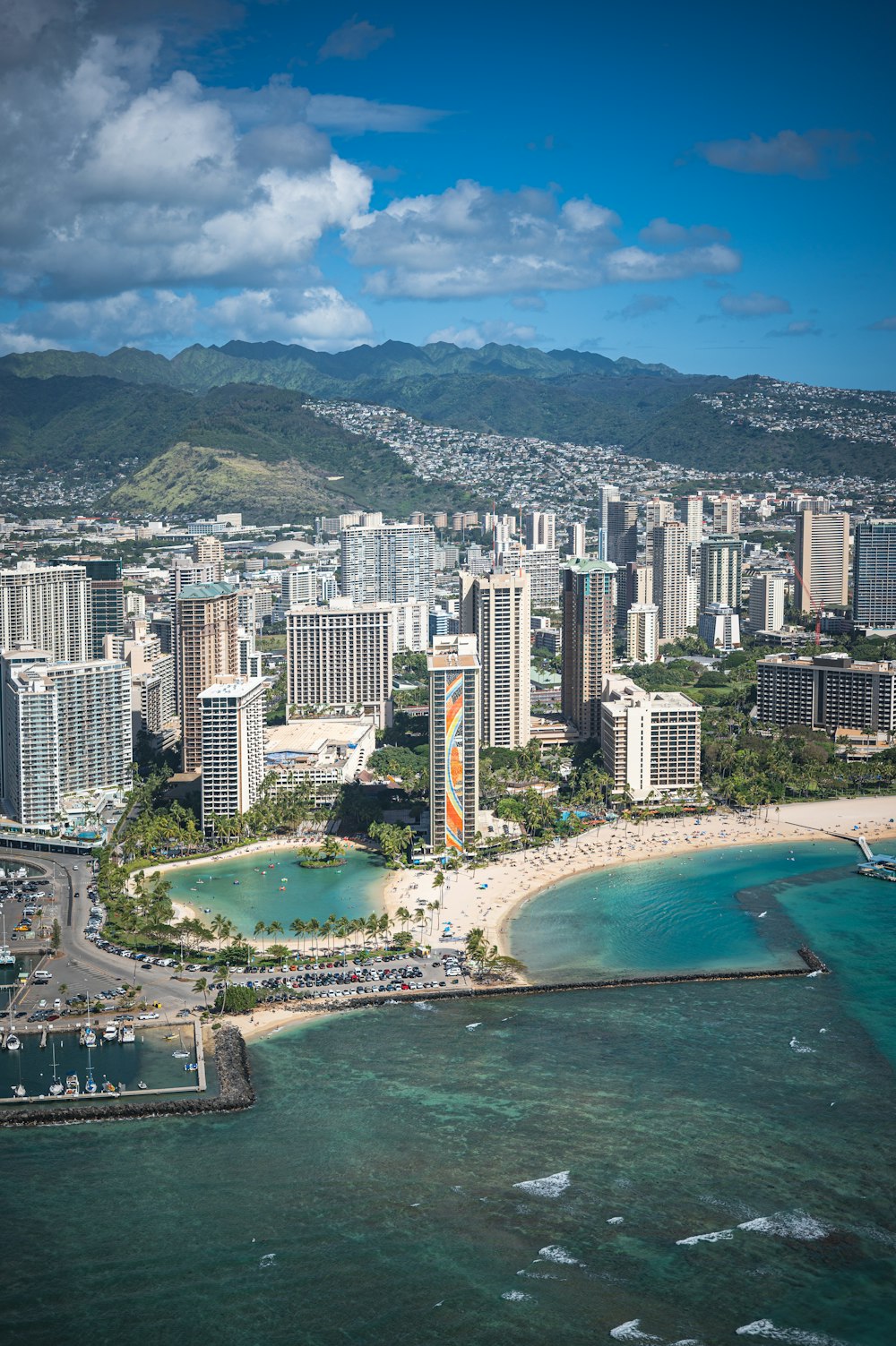 an aerial view of a city and the ocean