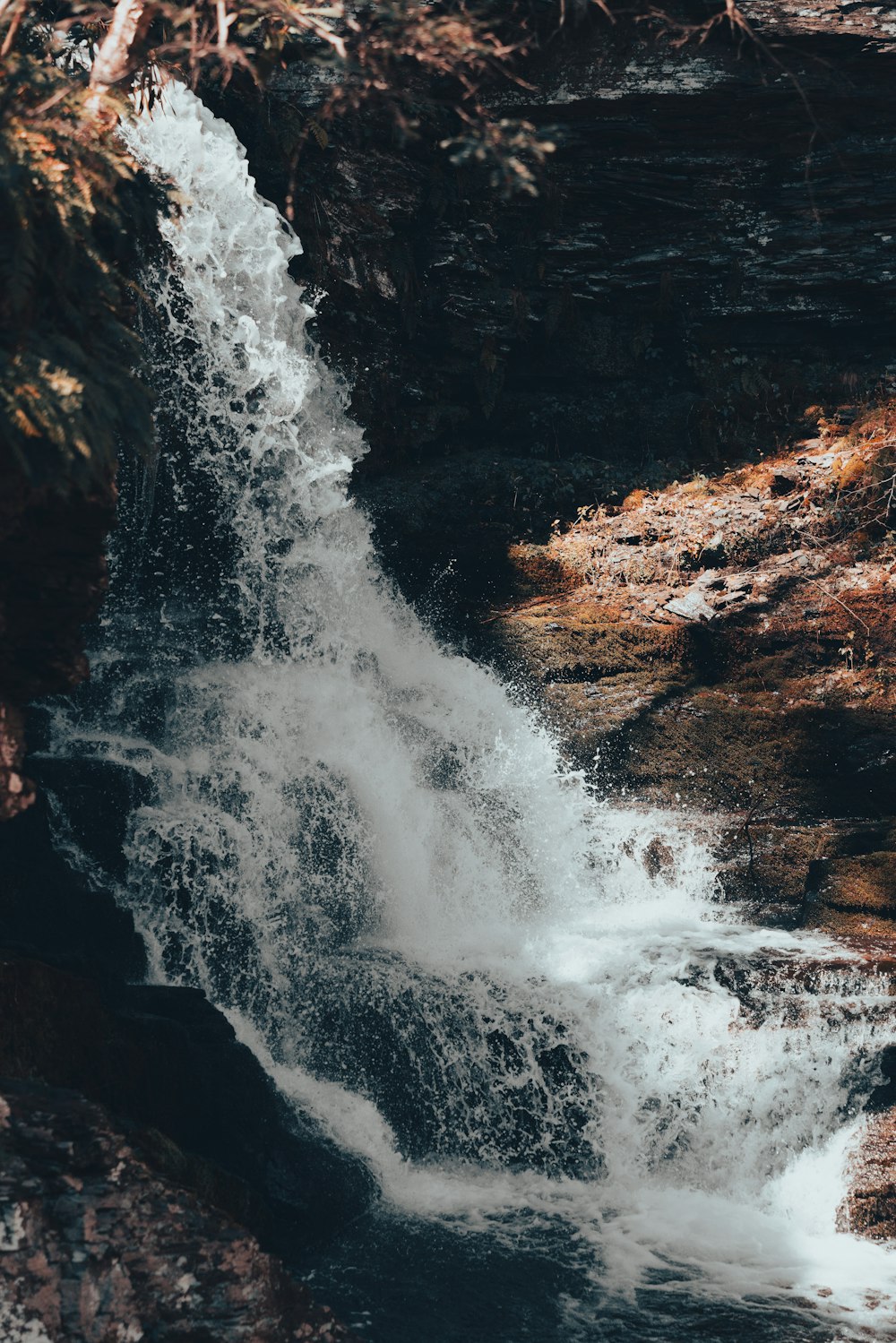 a waterfall with water coming out of it