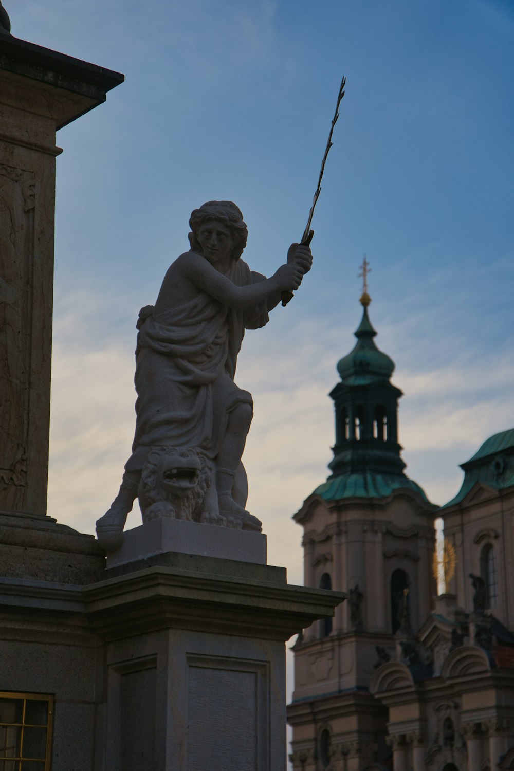 a statue of a man holding a fishing rod