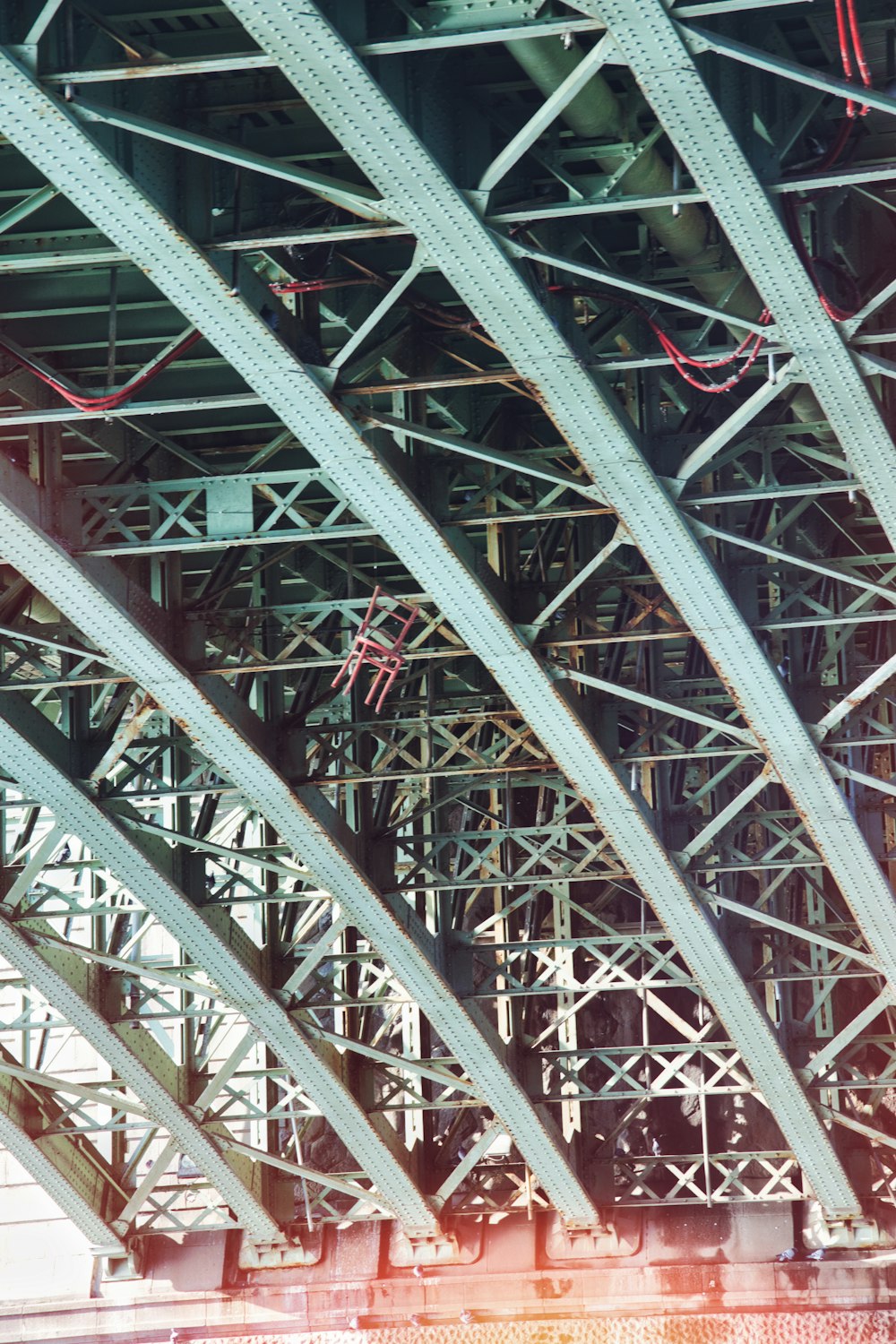 the underside of a bridge with metal beams