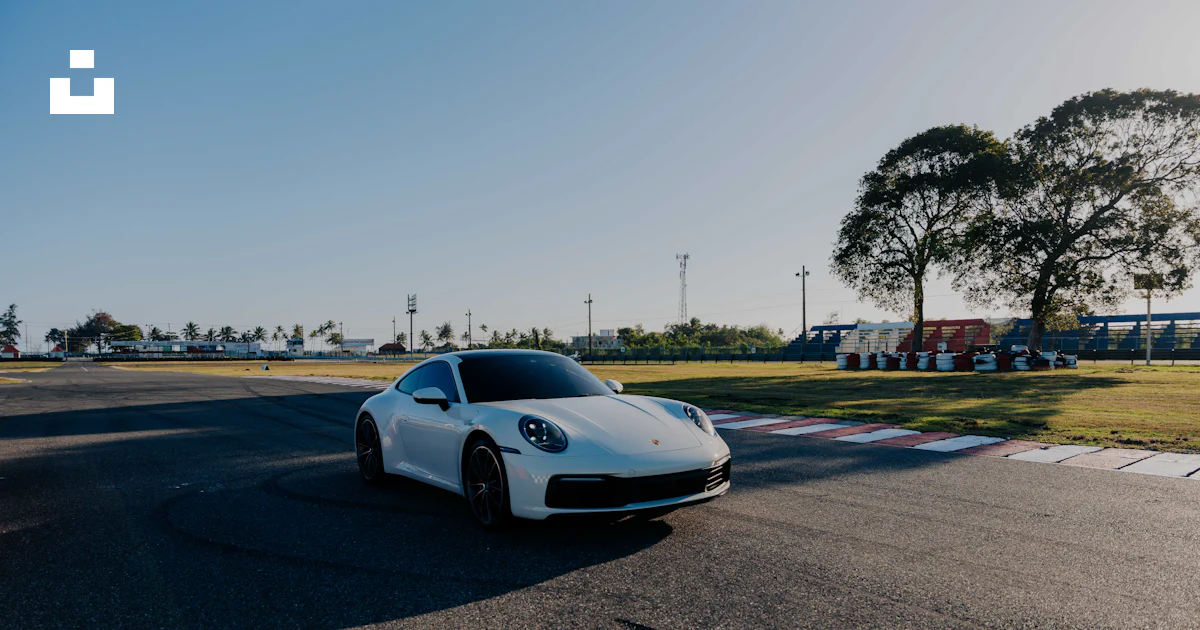 A white sports car driving down a race track photo – Free Wallpaper 4k ...