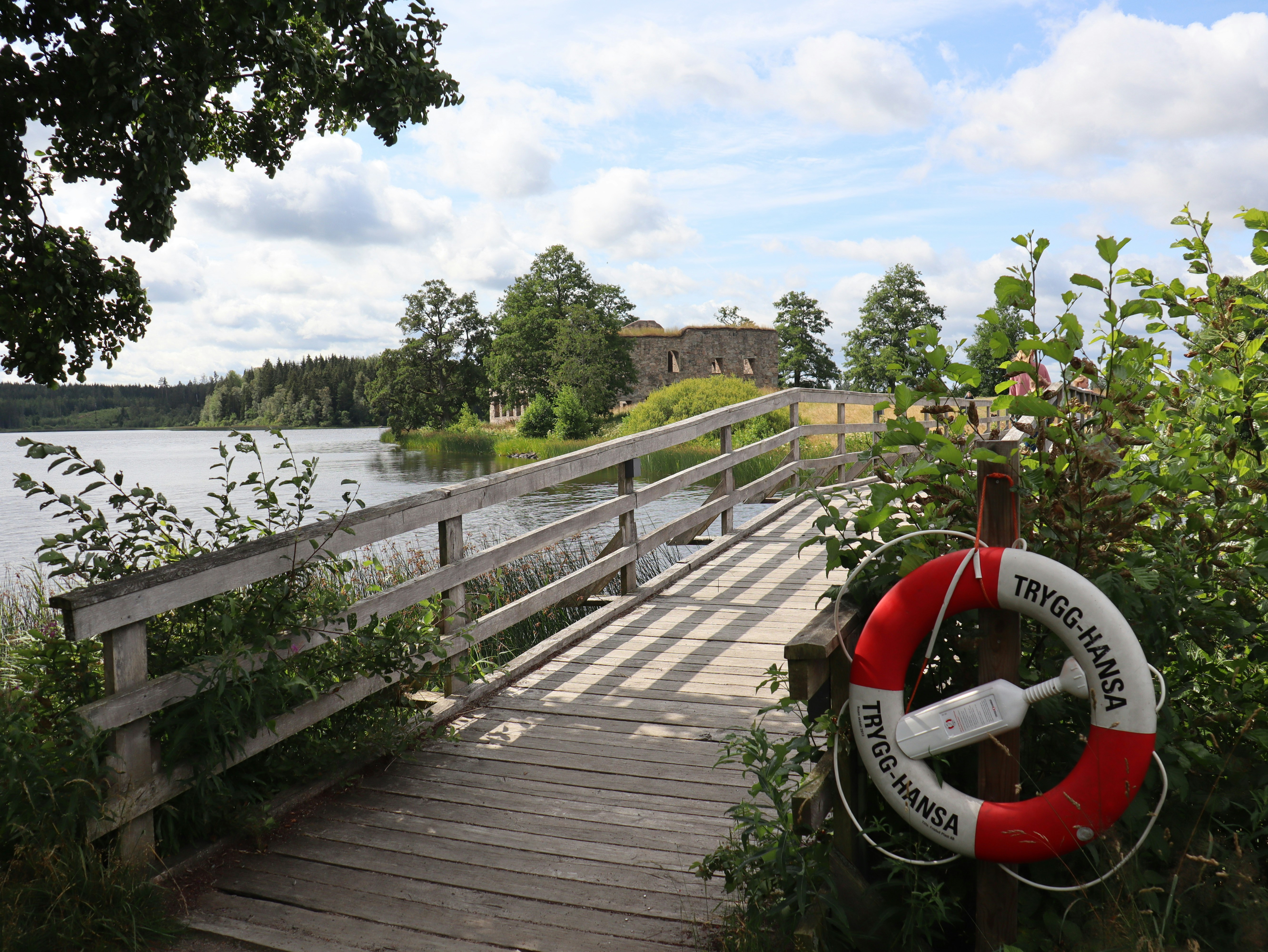 a wooden bridge with a life preserver on it