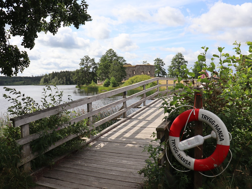 a wooden bridge with a life preserver on it