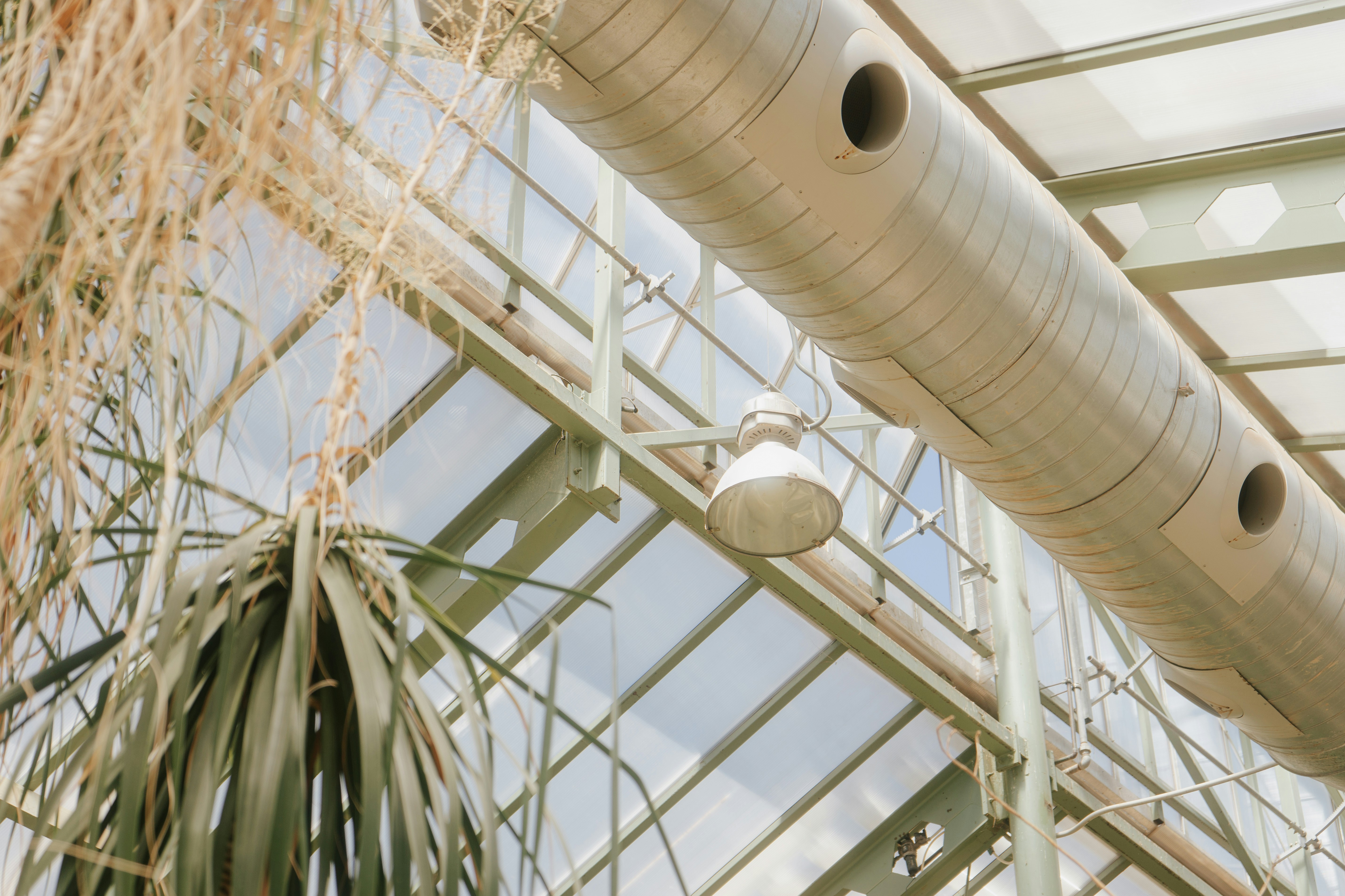 a large metal pipe attached to the side of a building