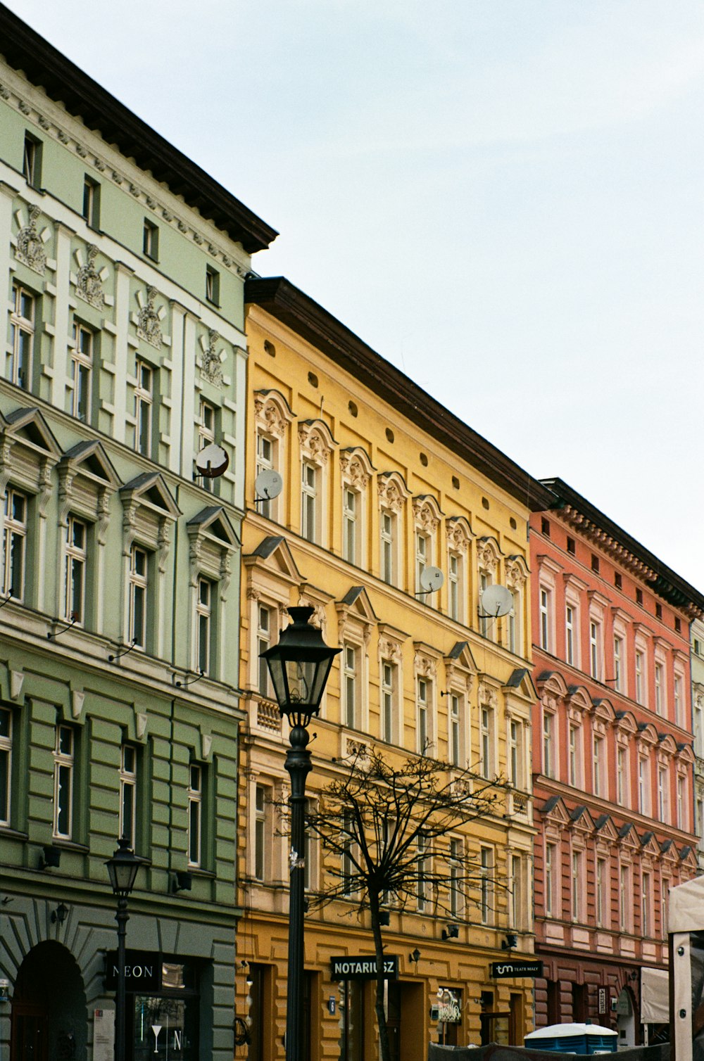 a street light in front of a row of buildings