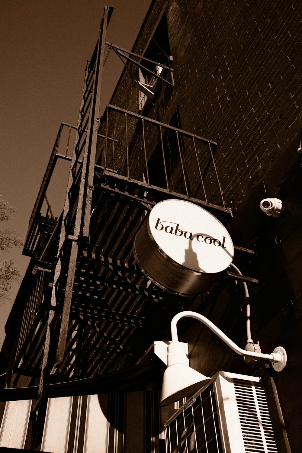 a black and white photo of a pub sign