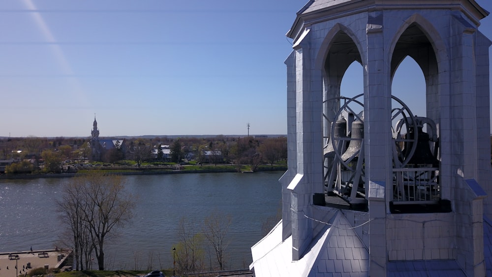 a clock tower overlooking a body of water