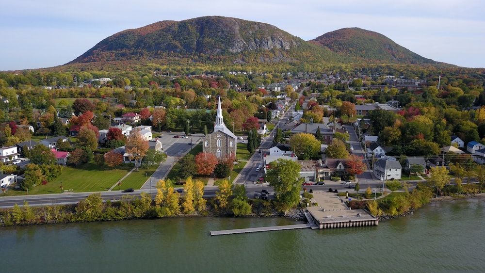 an aerial view of a small town by the water