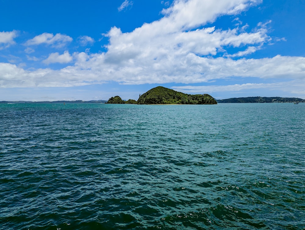 a body of water with a small island in the distance