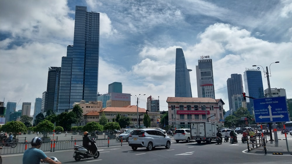 a busy city street with cars and motorcycles