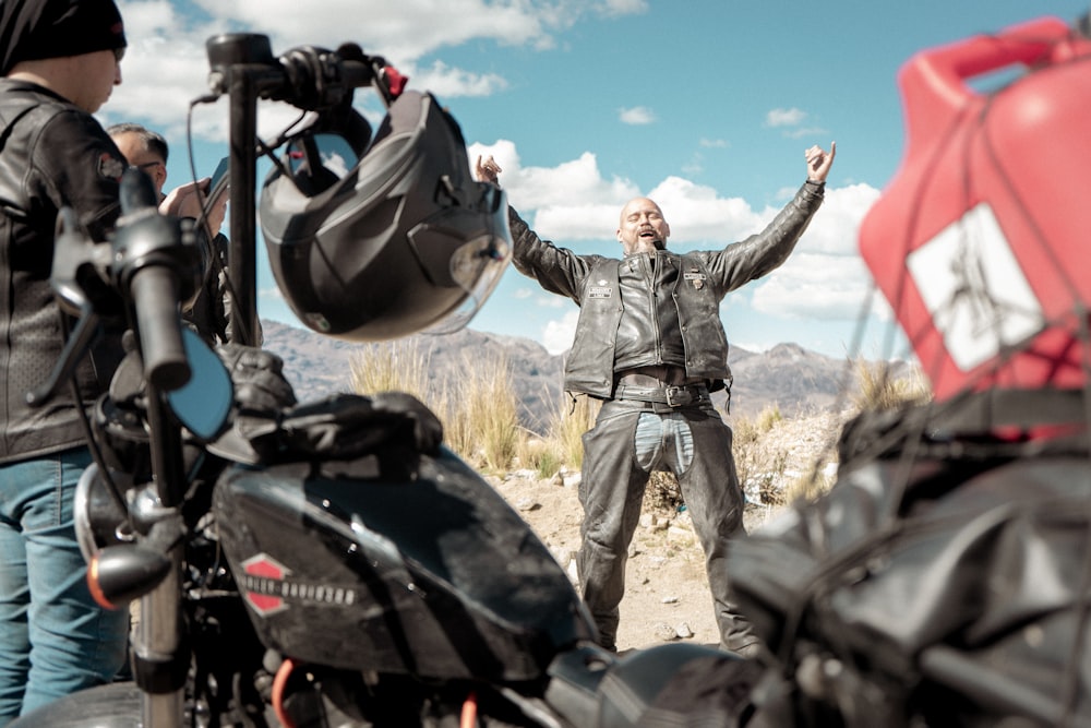 a man standing in front of a group of motorcycles