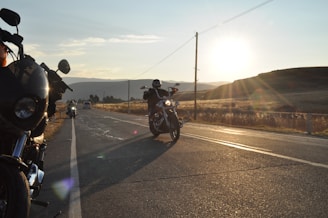 a couple of motorcycles that are sitting in the street