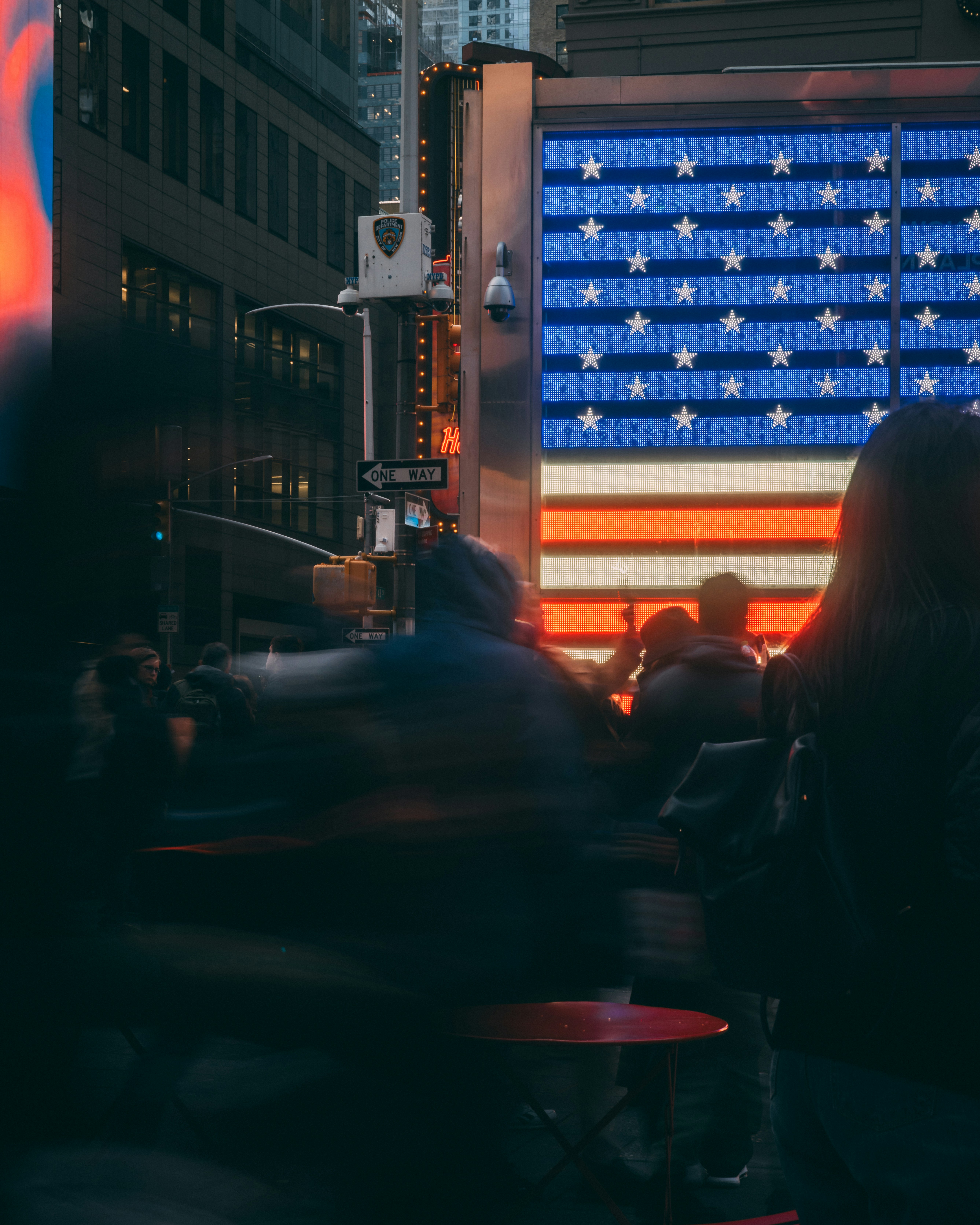 a large american flag is projected on the side of a building