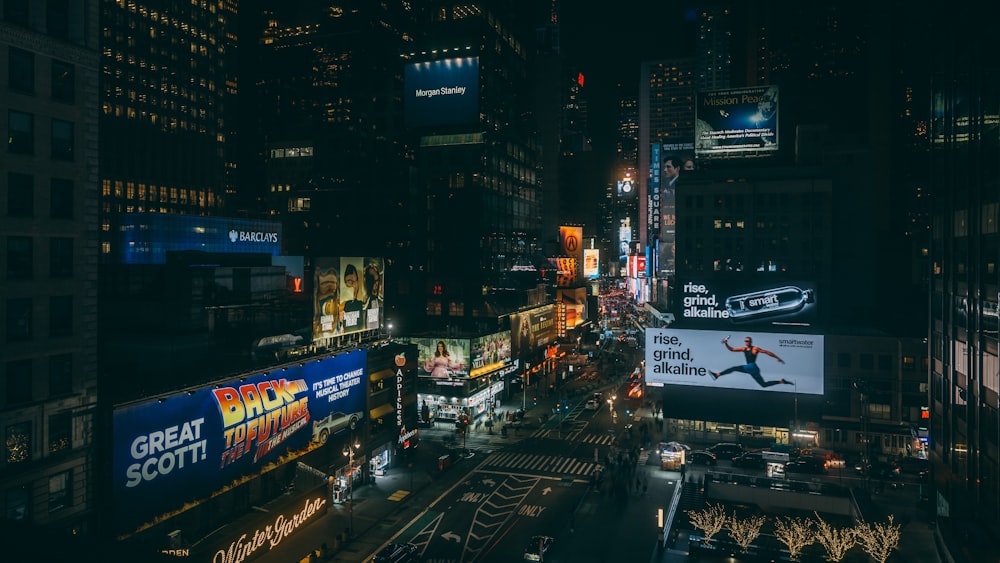 a busy city street at night with lots of traffic