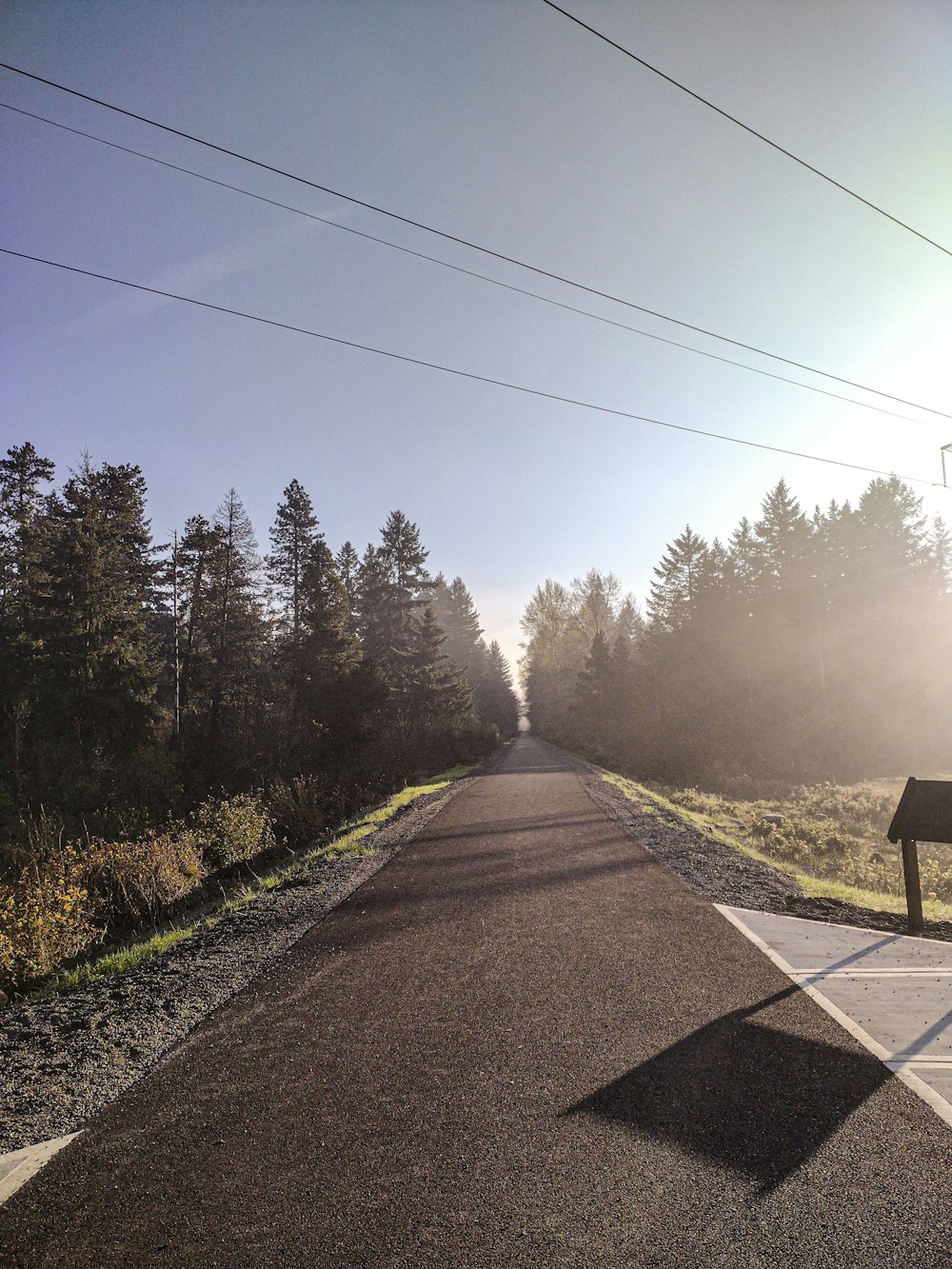 a road with a bench on the side of it