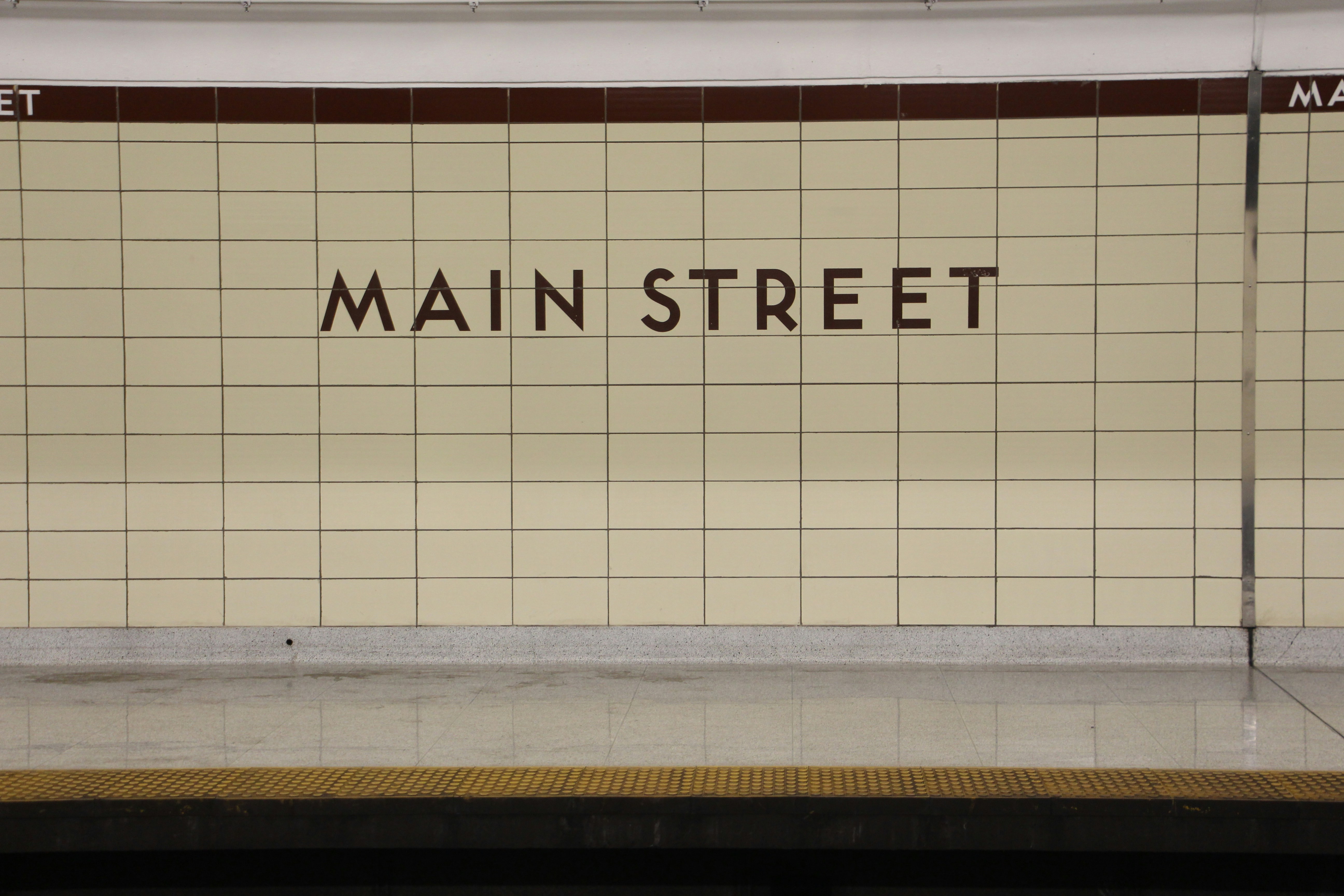 a subway station with a sign that reads main street