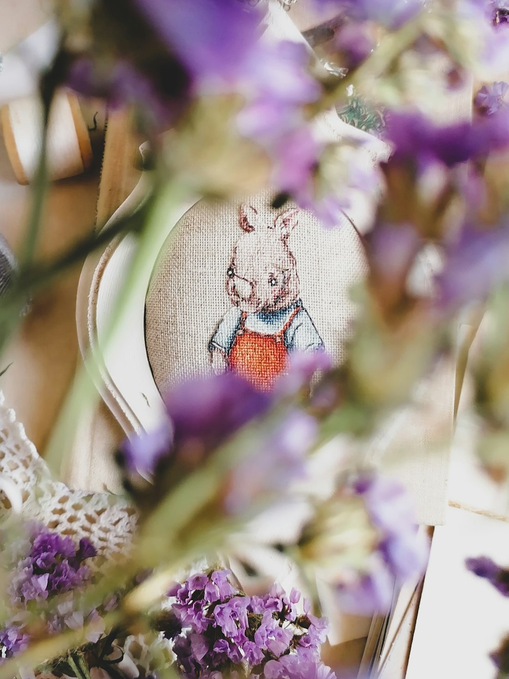a close up of a cross stitch picture of a bunny