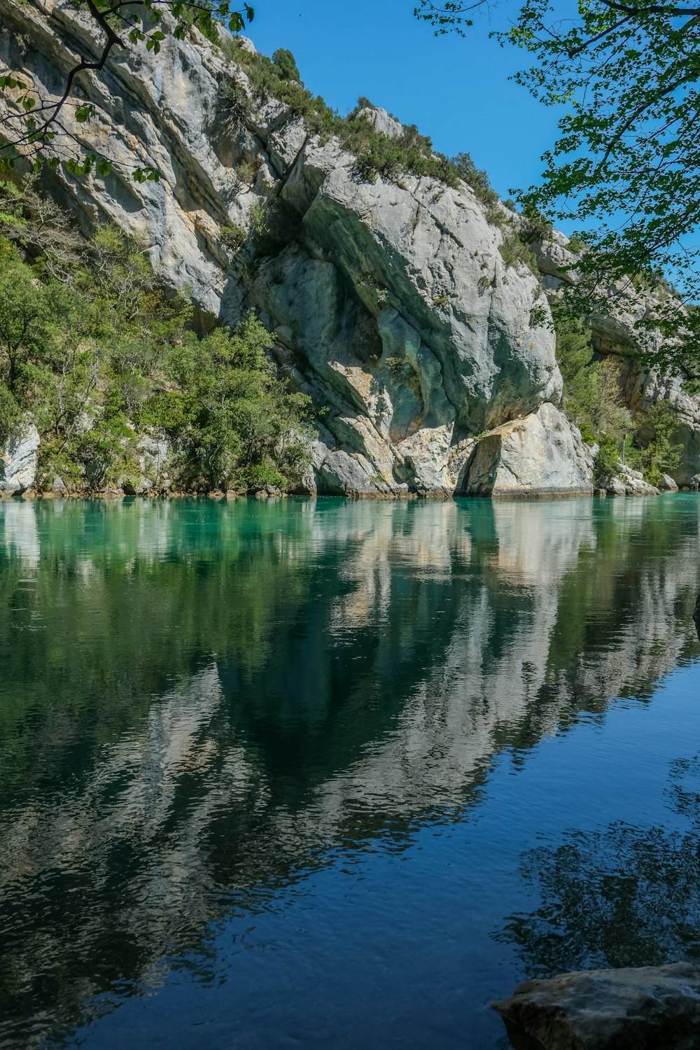 a body of water surrounded by mountains and trees