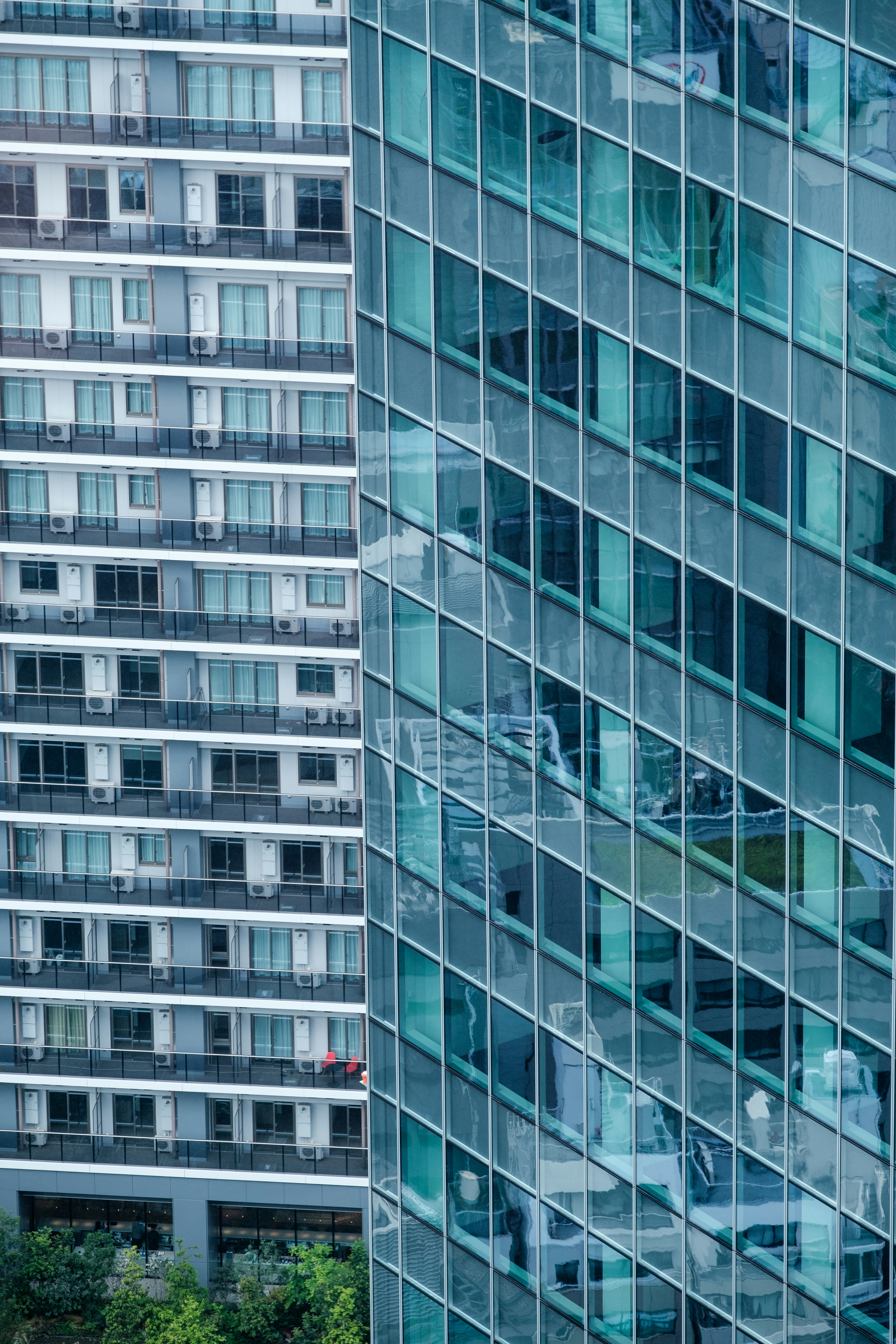 a very tall building next to a very tall building