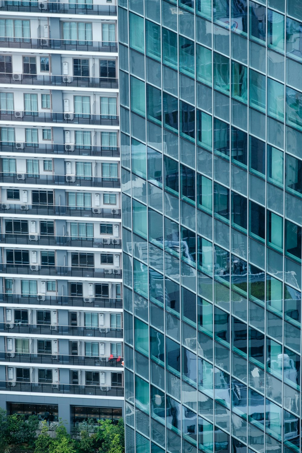 a very tall building next to a very tall building