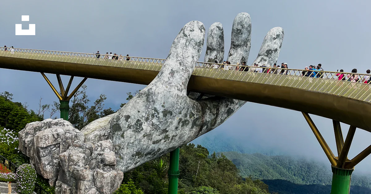 Top Bridge Hand A giant hand that is on top of a bridge photo – Free Bridge Image on ...